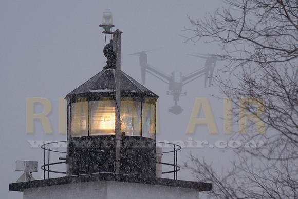 Snowing at Fort Point Light